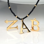 Naszyjnik turmalin kamień naturalny stal chirurgiczna literka 1.5 cm złoty damski